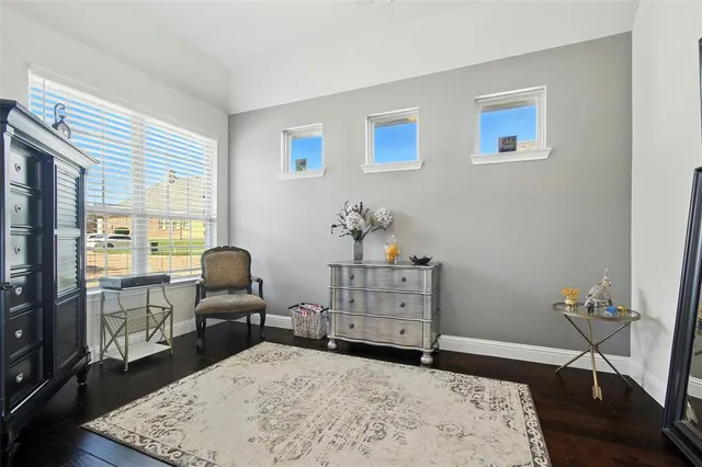 a bed room with a bed and a chair