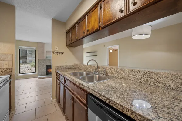 a kitchen with a sink and cabinets