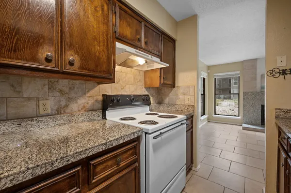 a kitchen with a stove and a microwave