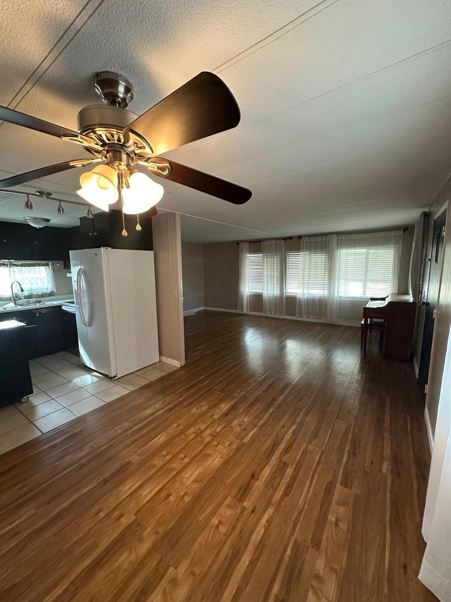 421 Stevens Road, Unit 52 Eagle Point, OR 97524 - Photo 5 of 18 a view of kitchen and dining room with wooden floor