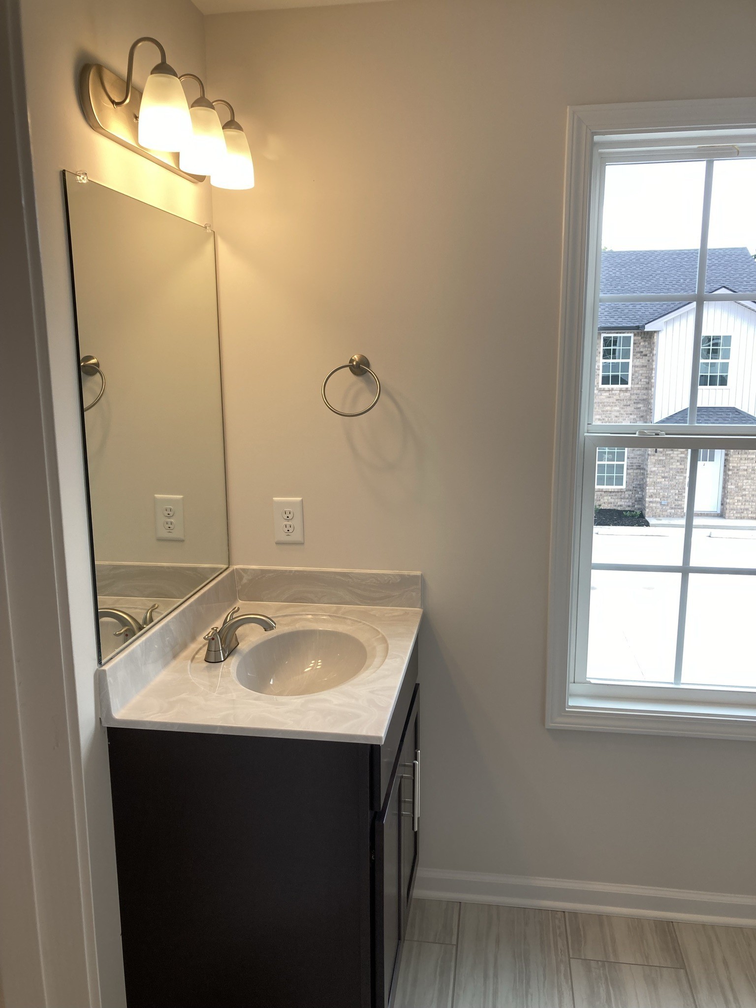 914 Peachers Mill Road, Unit A Clarksville, TN 37042 - Photo 16 of 30 a bathroom with a sink and a mirror