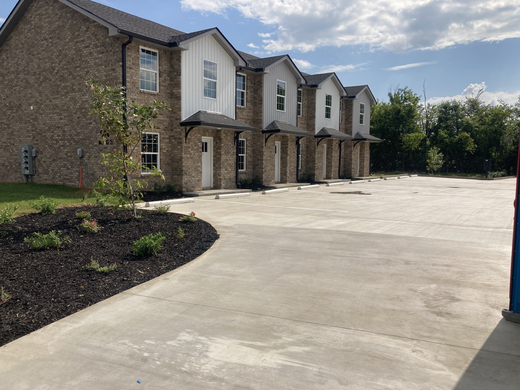 914 Peachers Mill Road, Unit A Clarksville, TN 37042 - Photo 2 of 30 a front view of a house with a yard and garage