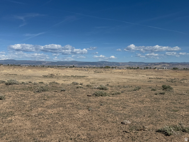 3100 East 5600 Goose Ranch Road South Vernal, UT 84078 - Photo 13 of 16 View of nature featuring mountains and rural landscape