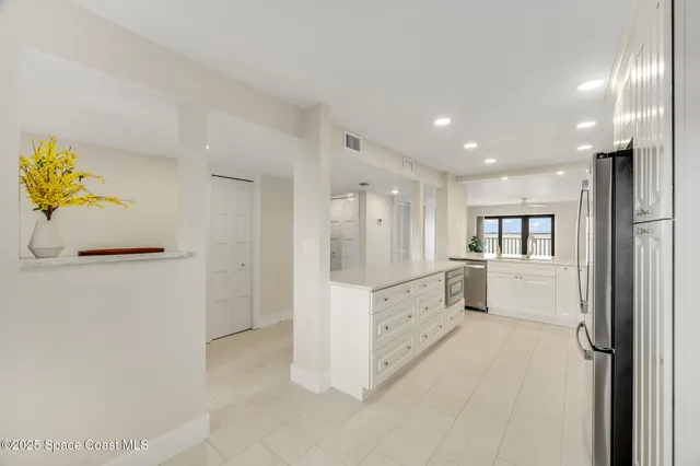 a bathroom with a shower and a glass door