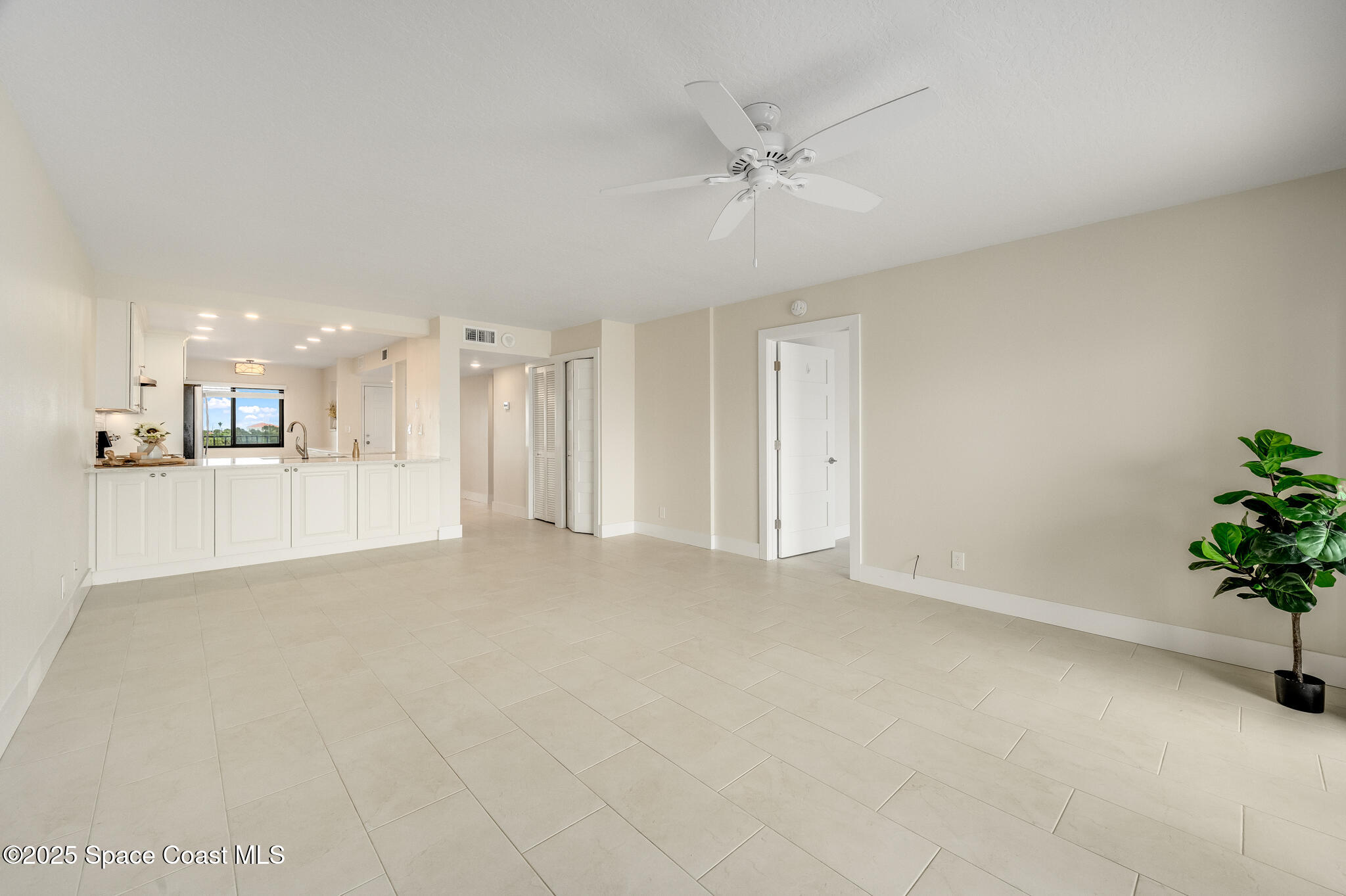 3220 River Villa Way, Unit 141 Melbourne Beach, FL 32951 - Photo 15 of 79 a view of a kitchen with a sink and a chandelier