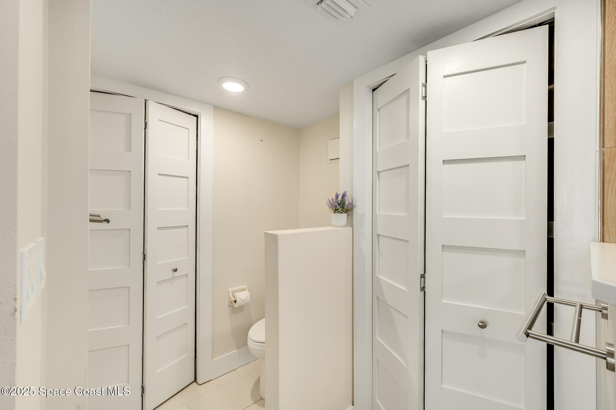 3220 River Villa Way, Unit 141 Melbourne Beach, FL 32951 - Photo 18 of 79 a bathroom with a shower and a glass door