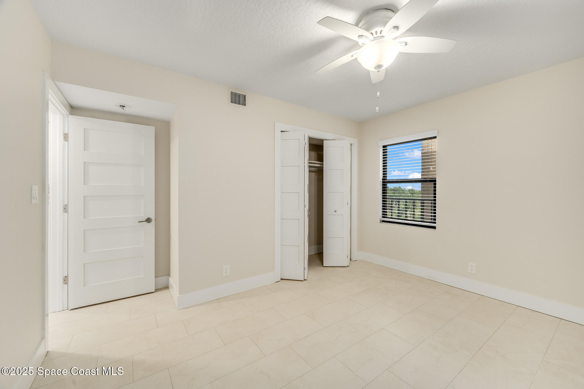 3220 River Villa Way, Unit 141 Melbourne Beach, FL 32951 - Photo 21 of 79 a view of an empty room with a window