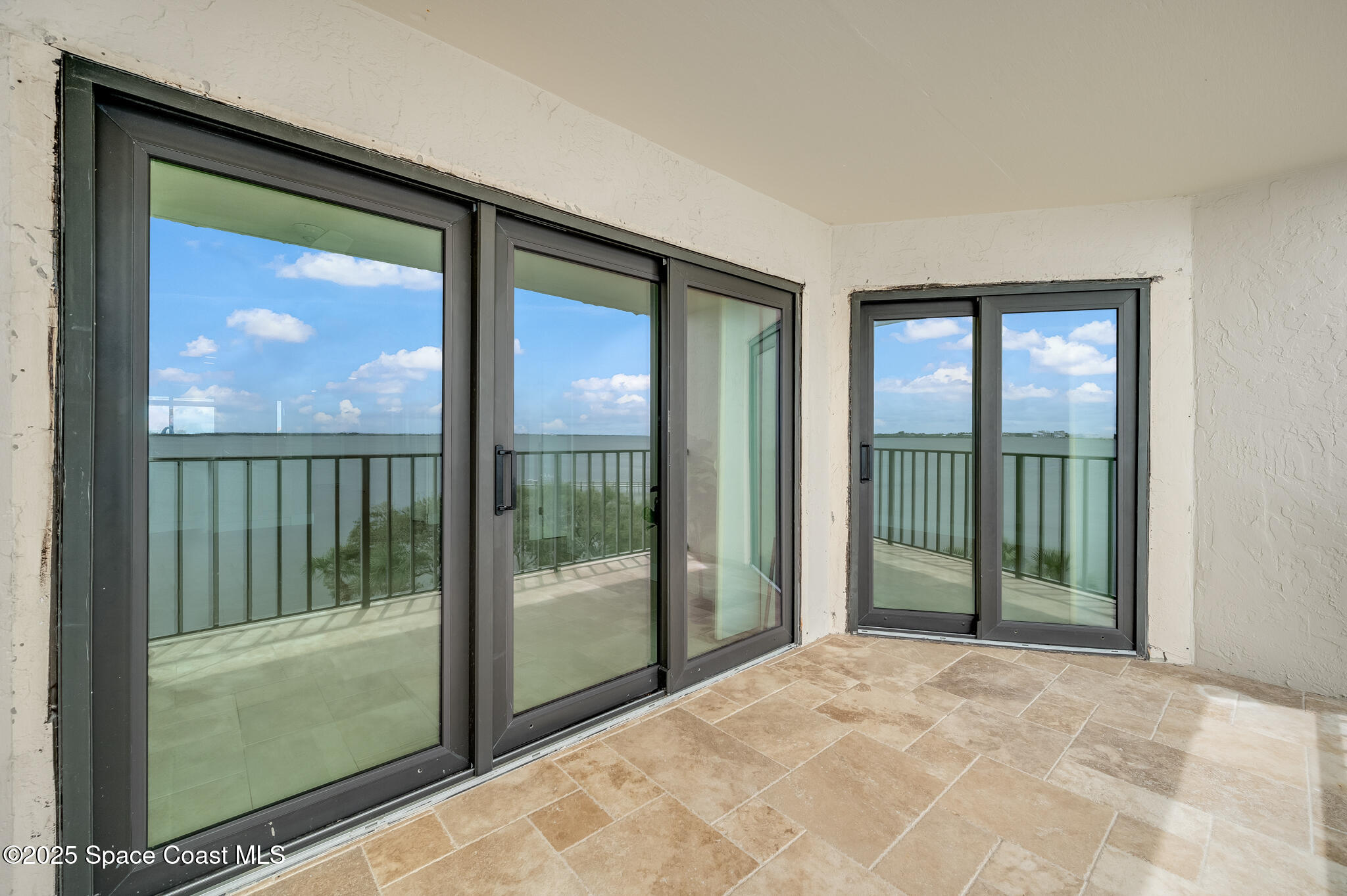 3220 River Villa Way, Unit 141 Melbourne Beach, FL 32951 - Photo 24 of 79 a view of a room that has a large window