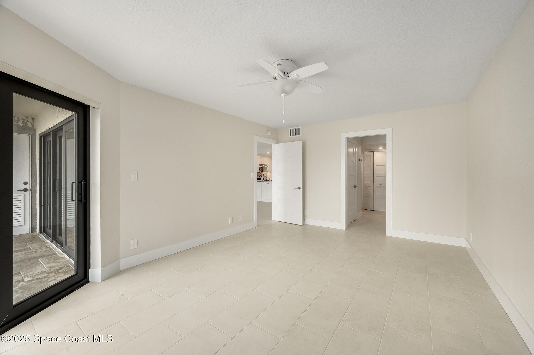 3220 River Villa Way, Unit 141 Melbourne Beach, FL 32951 - Photo 25 of 79 a view of an empty room with a window