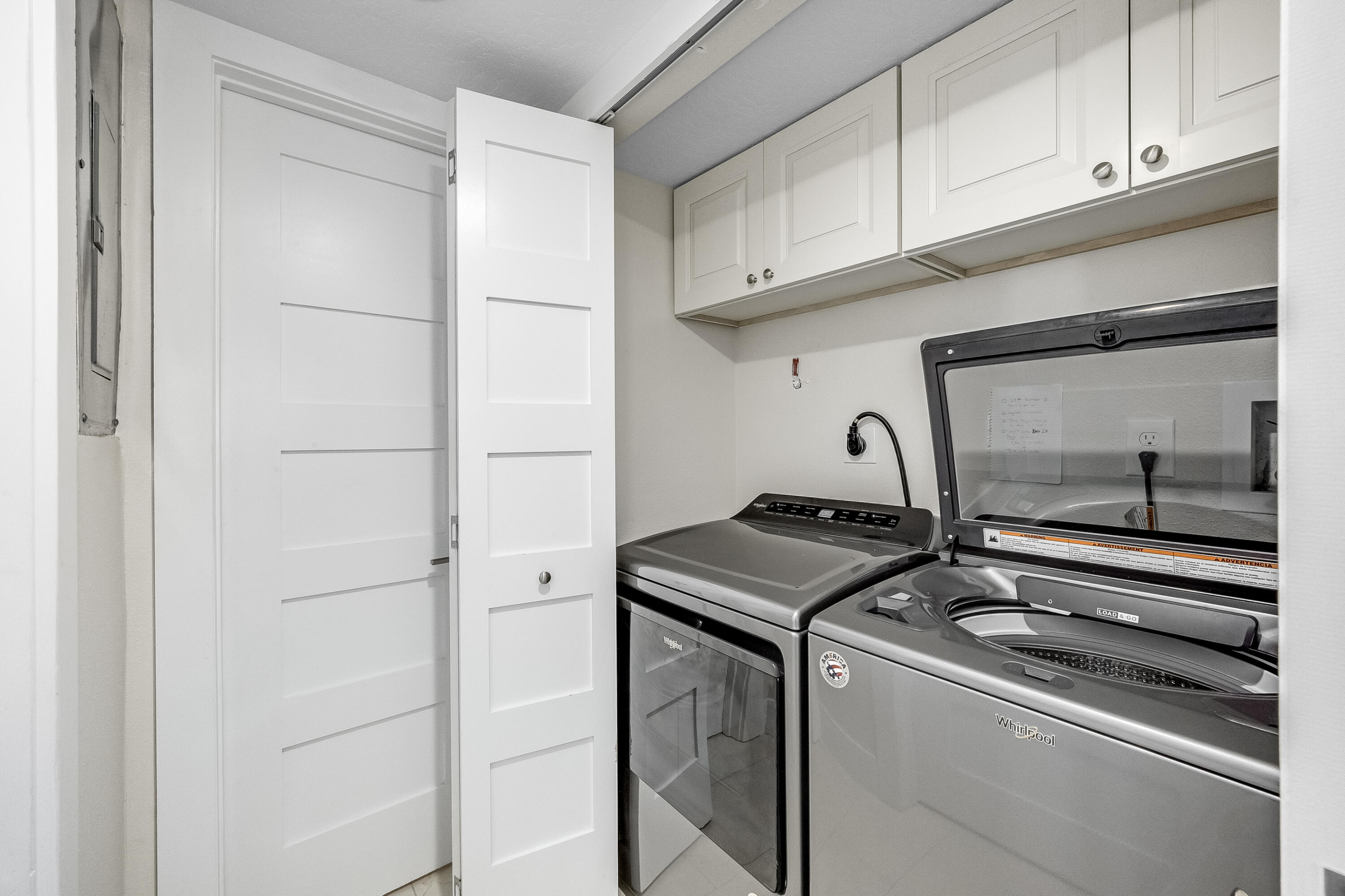 3220 River Villa Way, Unit 141 Melbourne Beach, FL 32951 - Photo 26 of 79 a utility room with dryer and washer