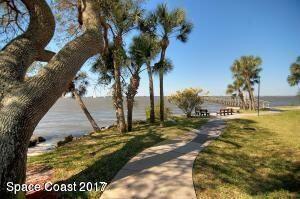 3220 River Villa Way, Unit 141 Melbourne Beach, FL 32951 - Photo 33 of 79 a view of a yard with palm trees