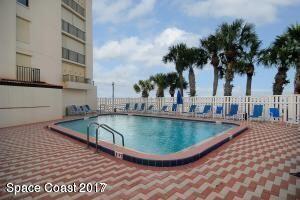 3220 River Villa Way, Unit 141 Melbourne Beach, FL 32951 - Photo 34 of 79 a view of a swimming pool with a chair