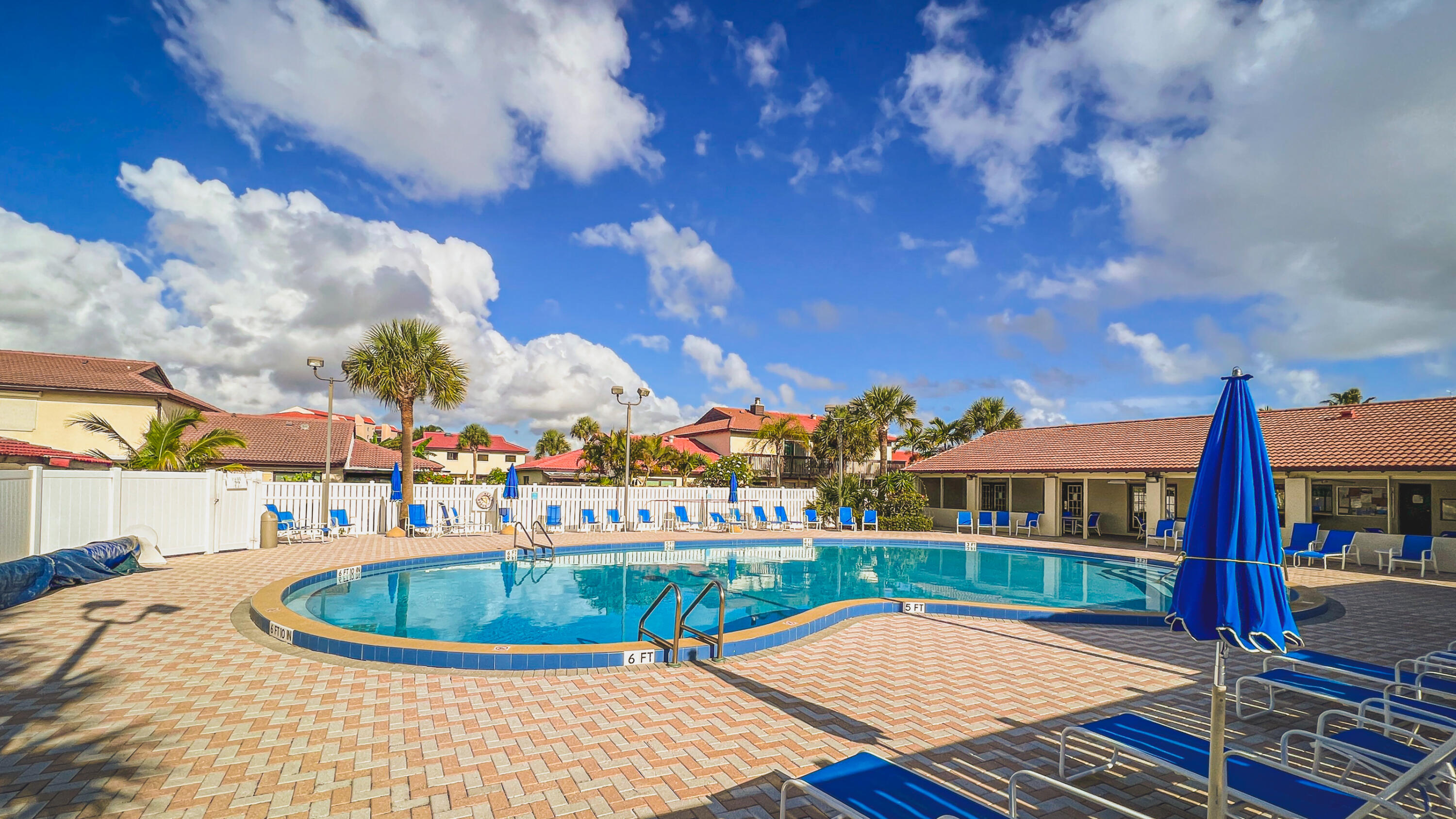 3220 River Villa Way, Unit 141 Melbourne Beach, FL 32951 - Photo 37 of 79 a view of a swimming pool with a lounge chair