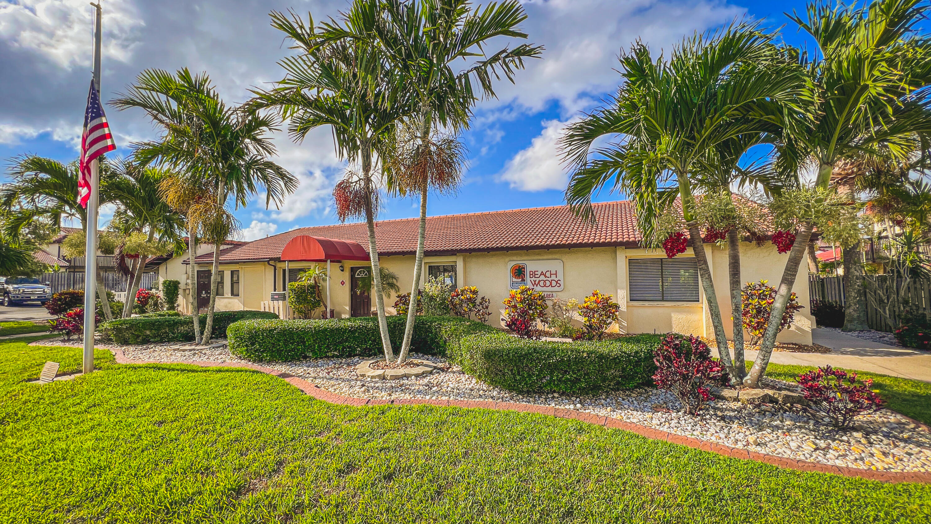 3220 River Villa Way, Unit 141 Melbourne Beach, FL 32951 - Photo 40 of 79 a view of a house with a yard and palm trees
