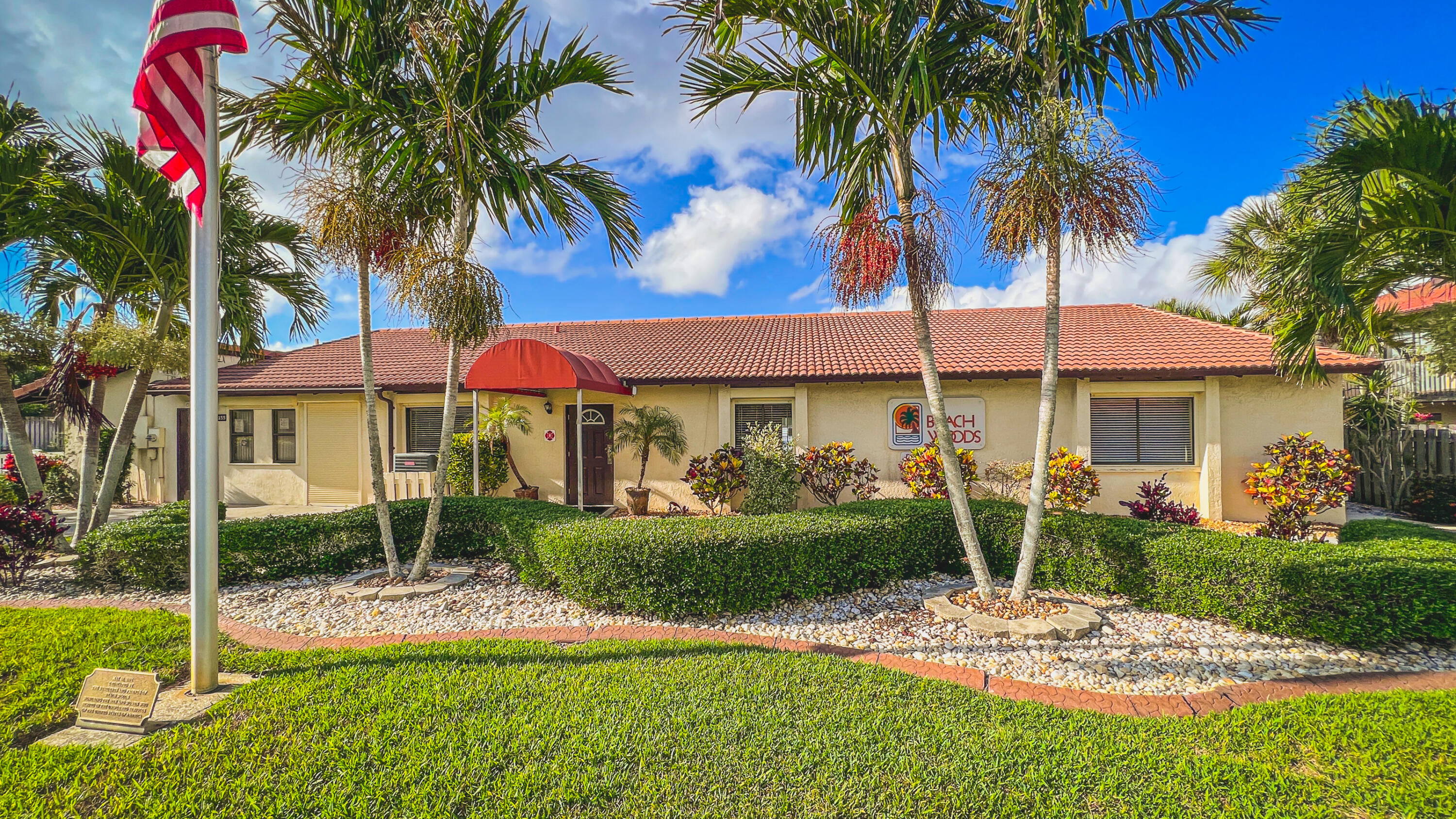 3220 River Villa Way, Unit 141 Melbourne Beach, FL 32951 - Photo 47 of 79 a view of a patio with a table and chairs under an umbrella