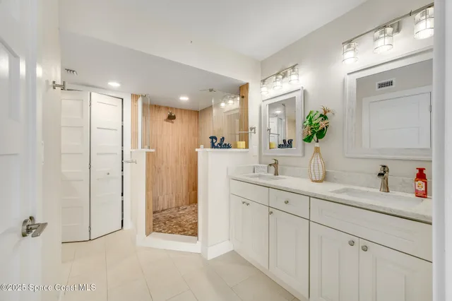 a kitchen with stainless steel appliances a refrigerator and a stove