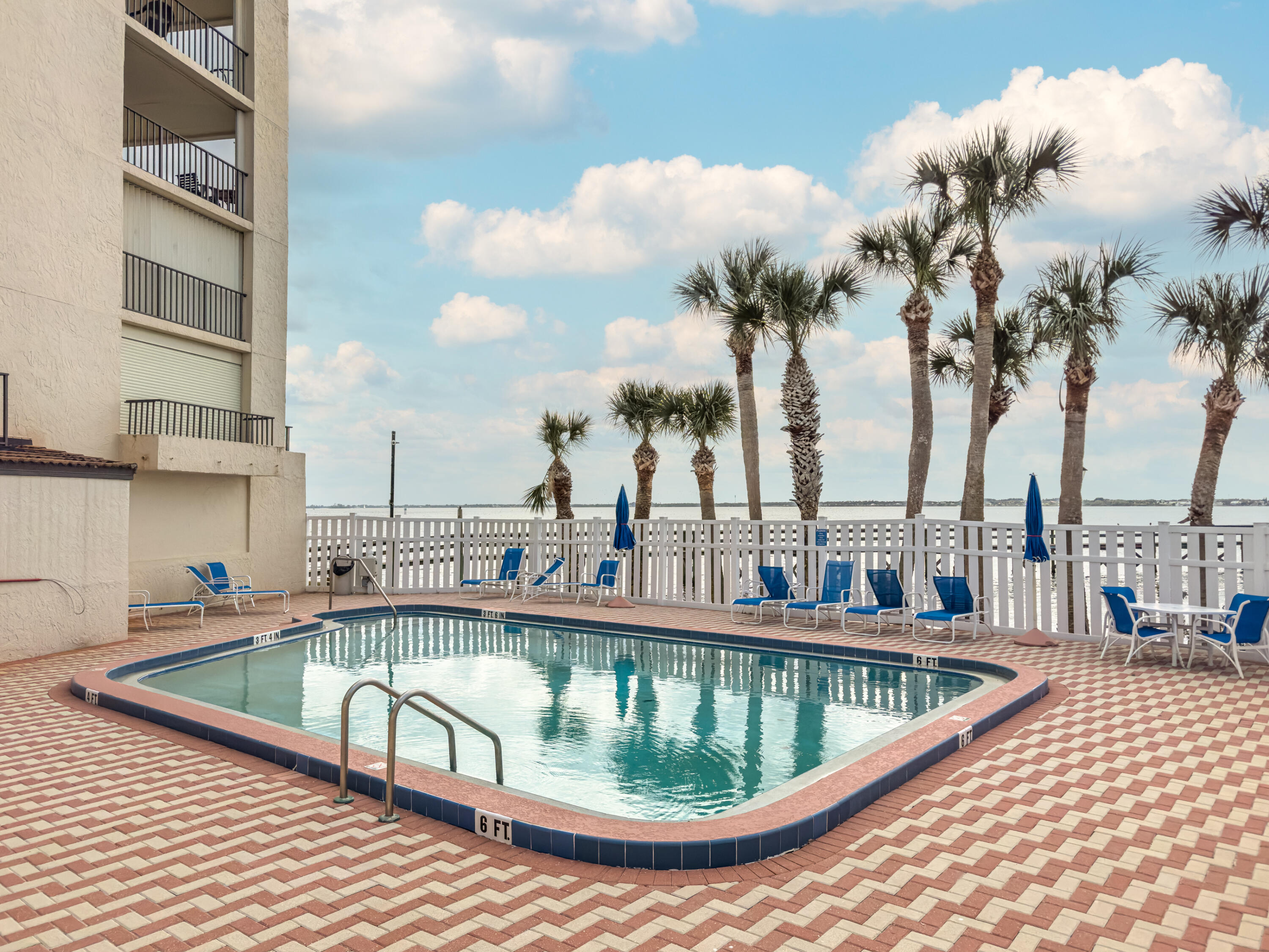 3220 River Villa Way, Unit 141 Melbourne Beach, FL 32951 - Photo 54 of 79 a view of a swimming pool with a terrace