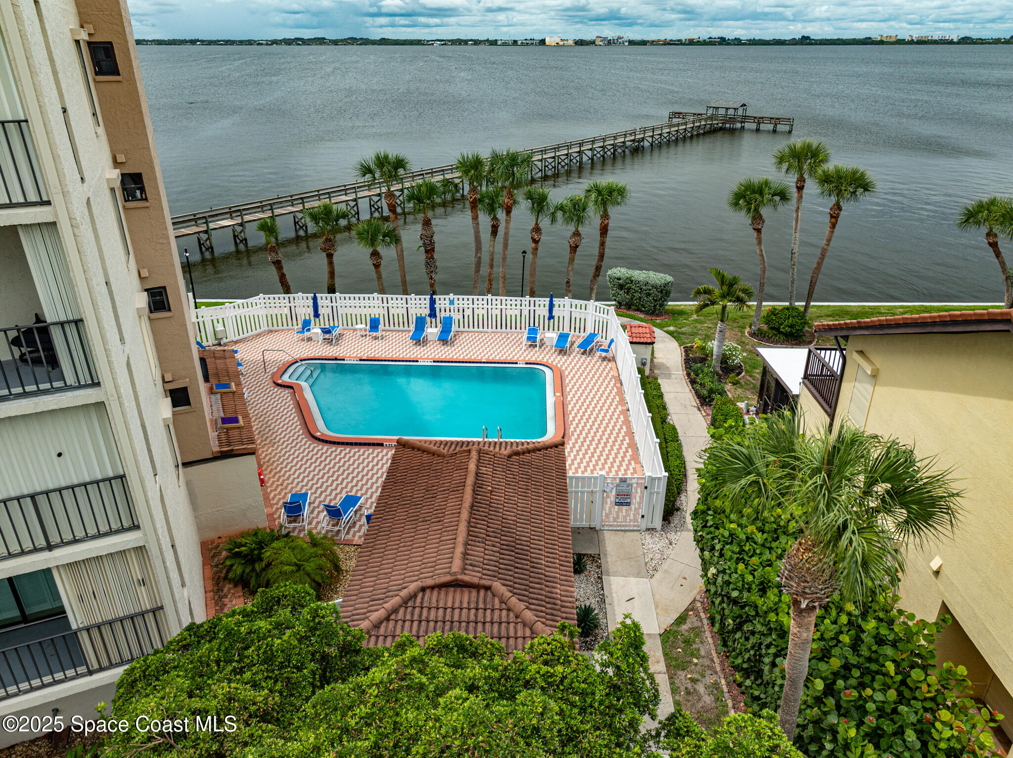 3220 River Villa Way, Unit 141 Melbourne Beach, FL 32951 - Photo 6 of 79 an aerial view of a house with outdoor space and lake view