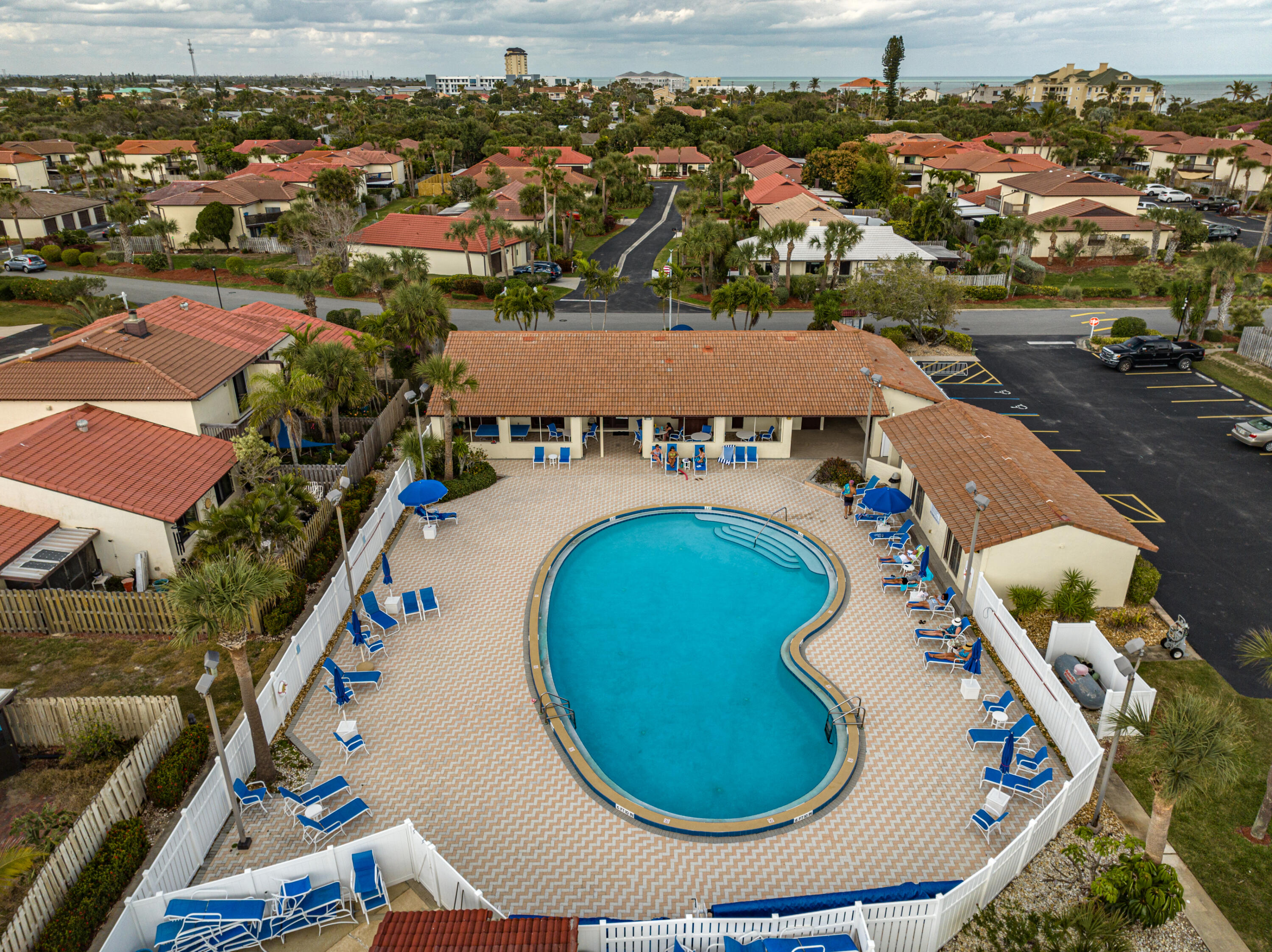 3220 River Villa Way, Unit 141 Melbourne Beach, FL 32951 - Photo 71 of 79 an aerial view of residential house with outdoor space and swimming pool