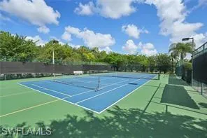 a room with pool table and windows