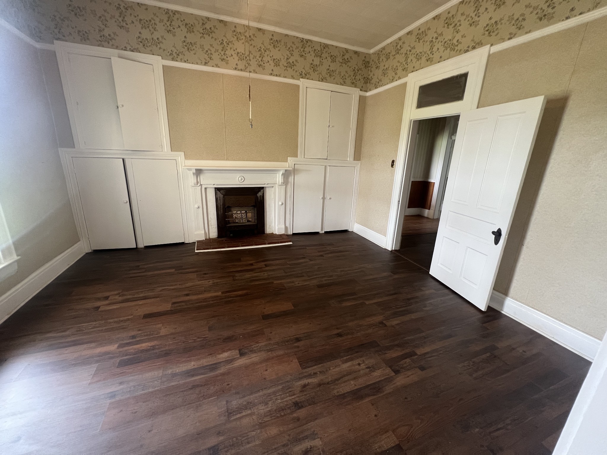 4948 William Woodard Road Springfield, TN 37172 - Photo 6 of 11 a view of a livingroom with wooden floor and a fireplace