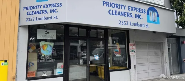 a view of a shop in a street