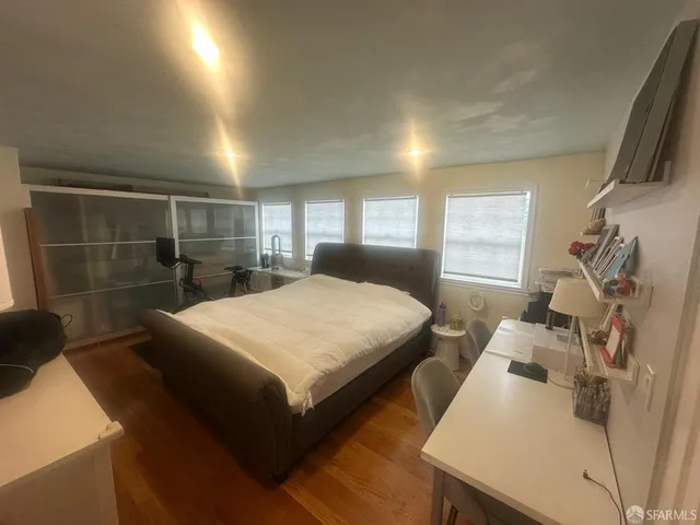 a bedroom with furniture and a window