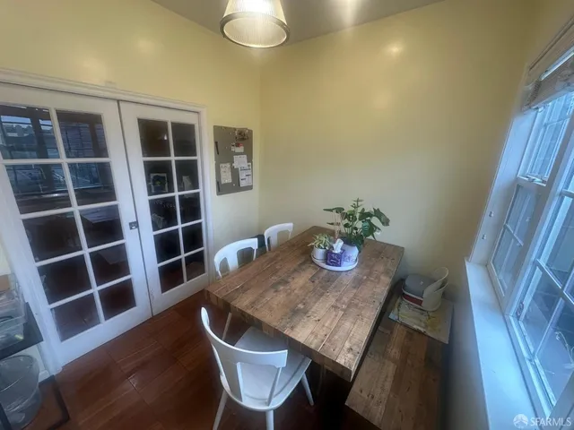 a bathroom with double vanity and a toilet