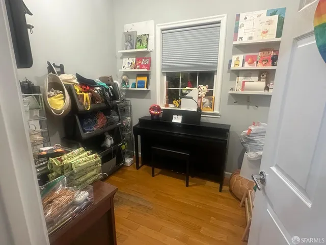 a view of a workspace with furniture and a fireplace