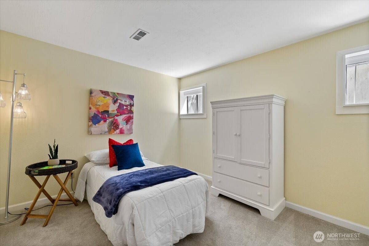 2606 49th Place Southwest Everett, WA 98203 - Photo 20 of 37 a bedroom with a bed and a painting on the wall