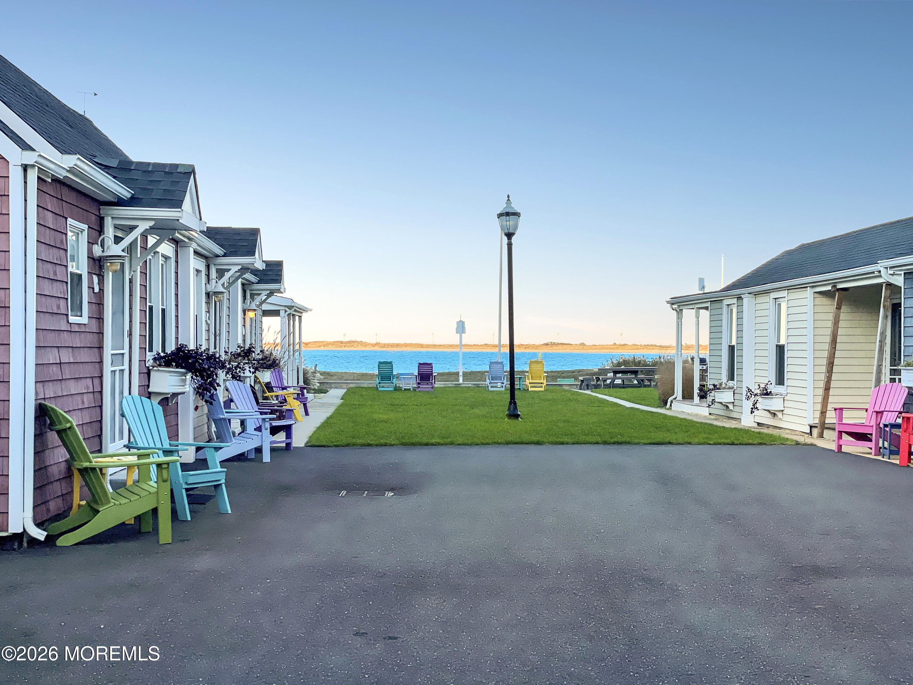 54 5th Street, Unit A Highlands, NJ 07732 - Photo 2 of 15 a view of a house with big yard and sitting area
