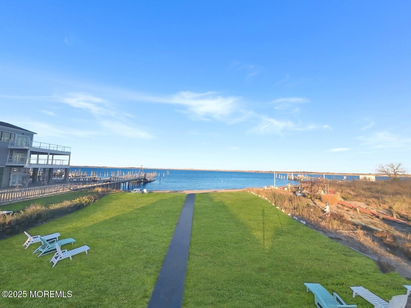 54 5th Street, Unit A Highlands, NJ 07732 - Photo 4 of 15 a view of a lake with houses in the back