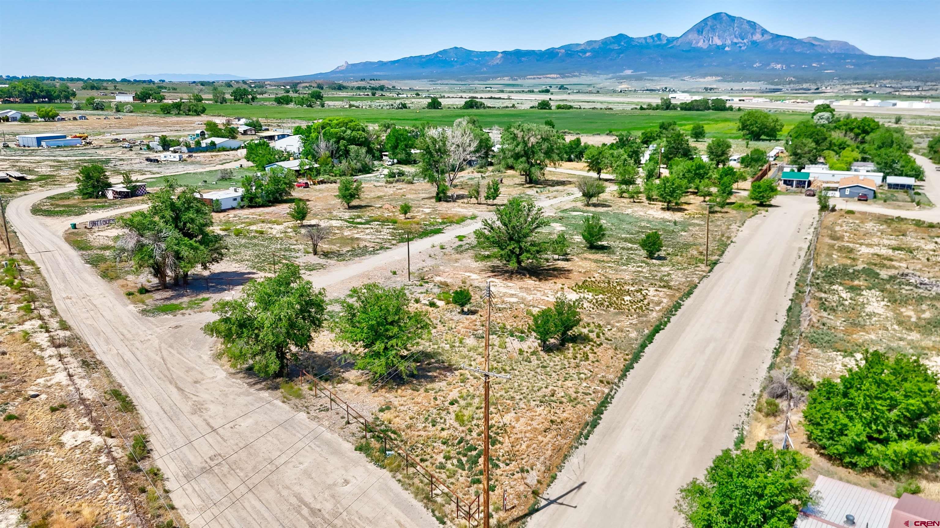 6493 Road 23.6 Cortez, CO 81321 - Photo 3 of 44 a view of a city with a lake