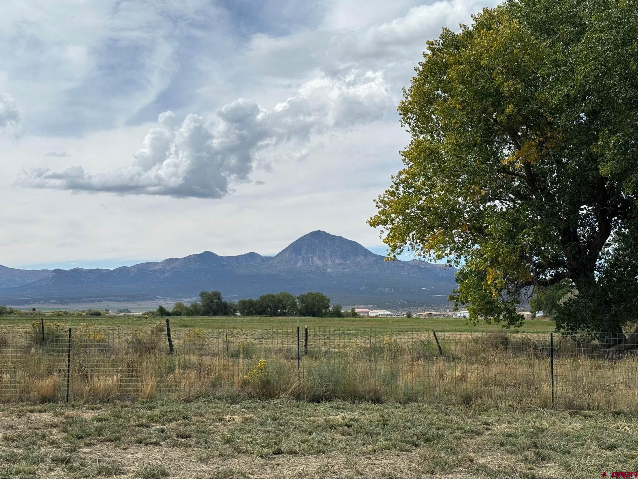 6493 Road 23.6 Cortez, CO 81321 - Photo 38 of 44 a view of a lake with a mountain in the background