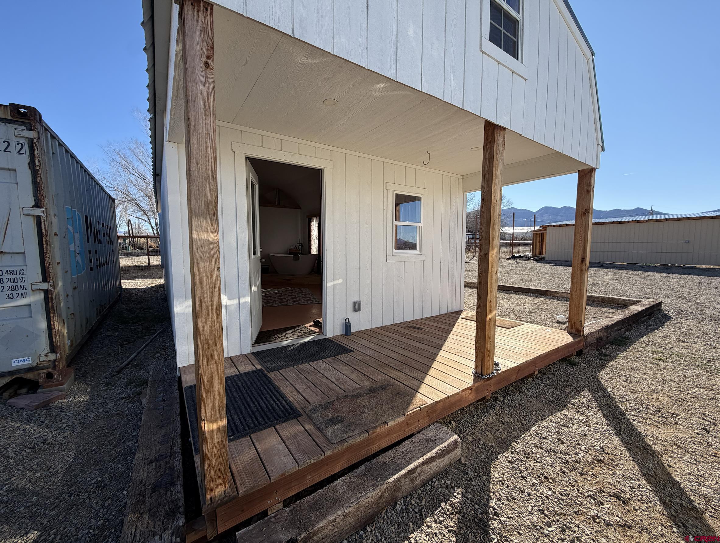 6493 Road 23.6 Cortez, CO 81321 - Photo 4 of 44 a view of a balcony with floor to ceiling windows