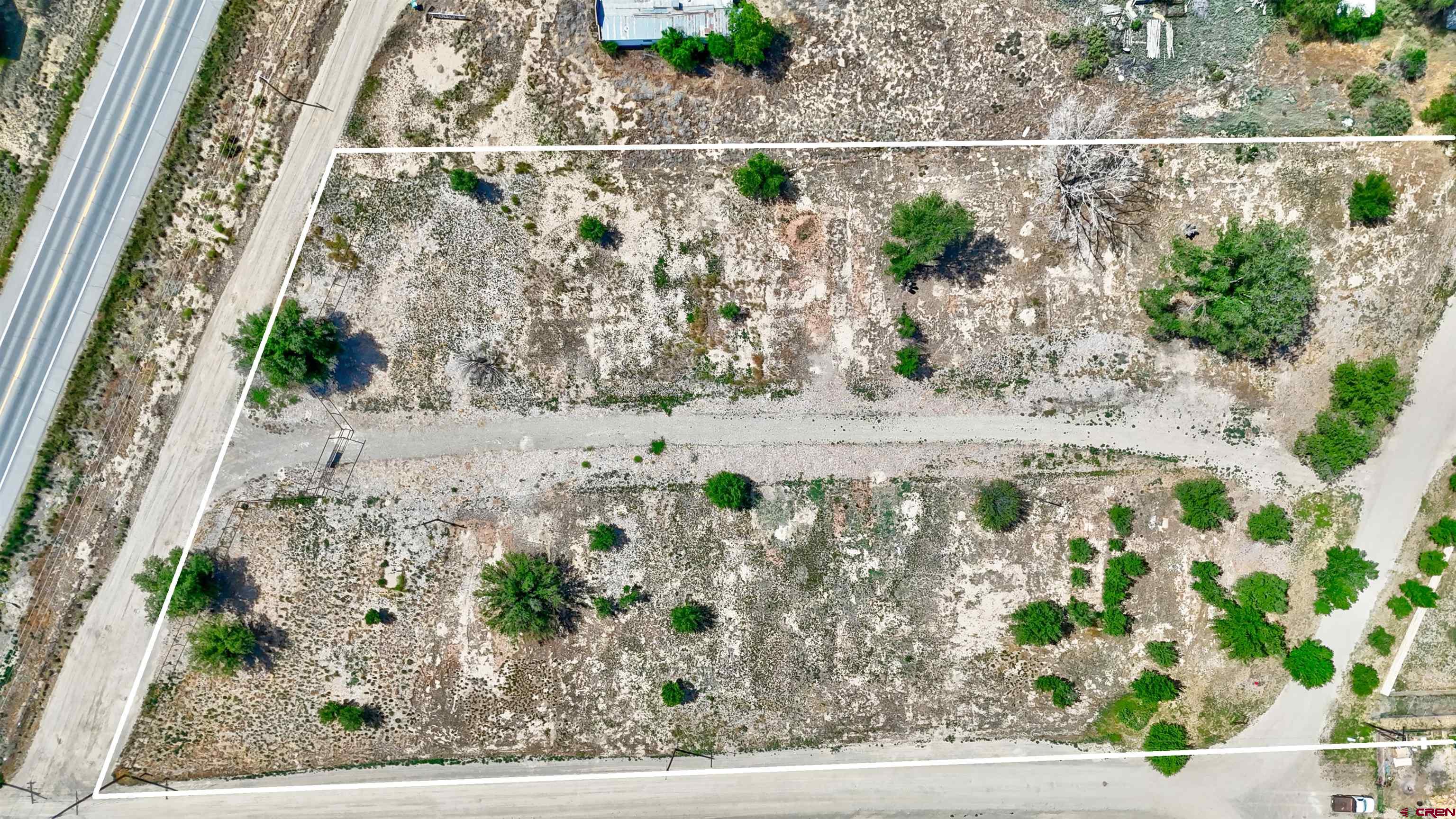 6493 Road 23.6 Cortez, CO 81321 - Photo 7 of 44 a view of a yard with a bench