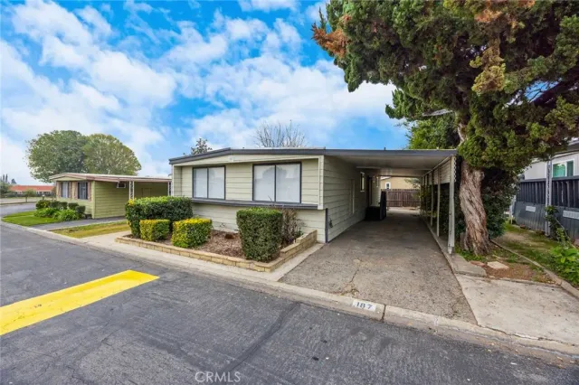 a view of backyard with a garden and outdoor seating