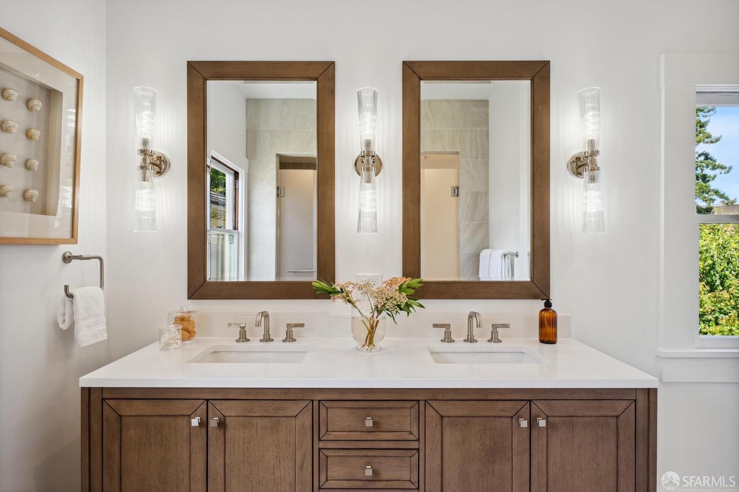 2518 Etna Street Berkeley, CA 94704 - Photo 42 of 99 a bathroom with double sink and a mirror