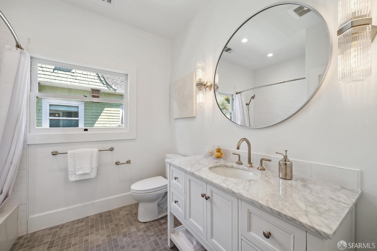 2518 Etna Street Berkeley, CA 94704 - Photo 55 of 99 a spacious bathroom with a granite countertop sink mirror and toilet