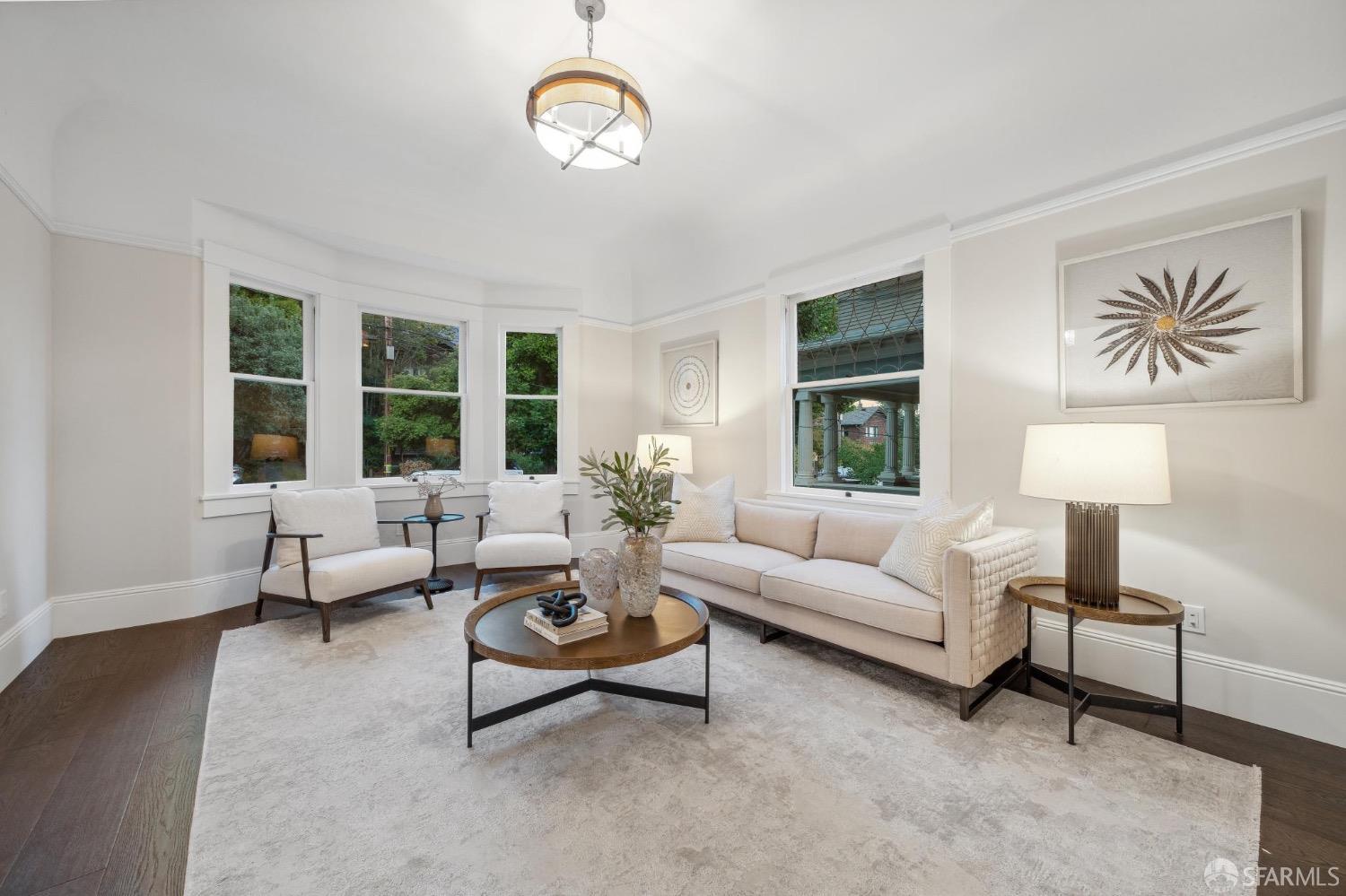 2518 Etna Street Berkeley, CA 94704 - Photo 84 of 99 a living room with furniture a lamp and a large window