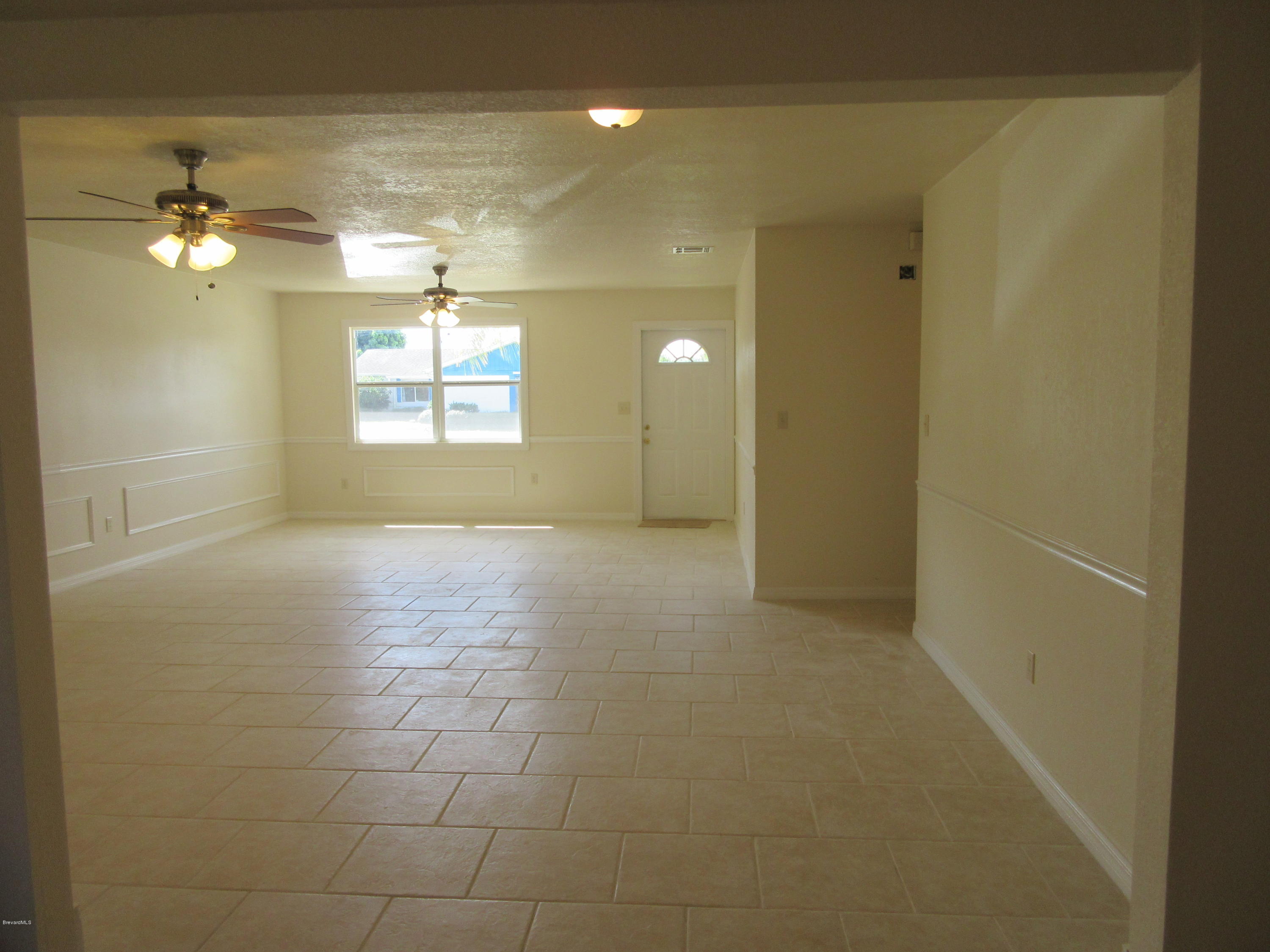 1260 Creel Road Northeast Palm Bay, FL 32905 - Photo 3 of 30 Living and Dining