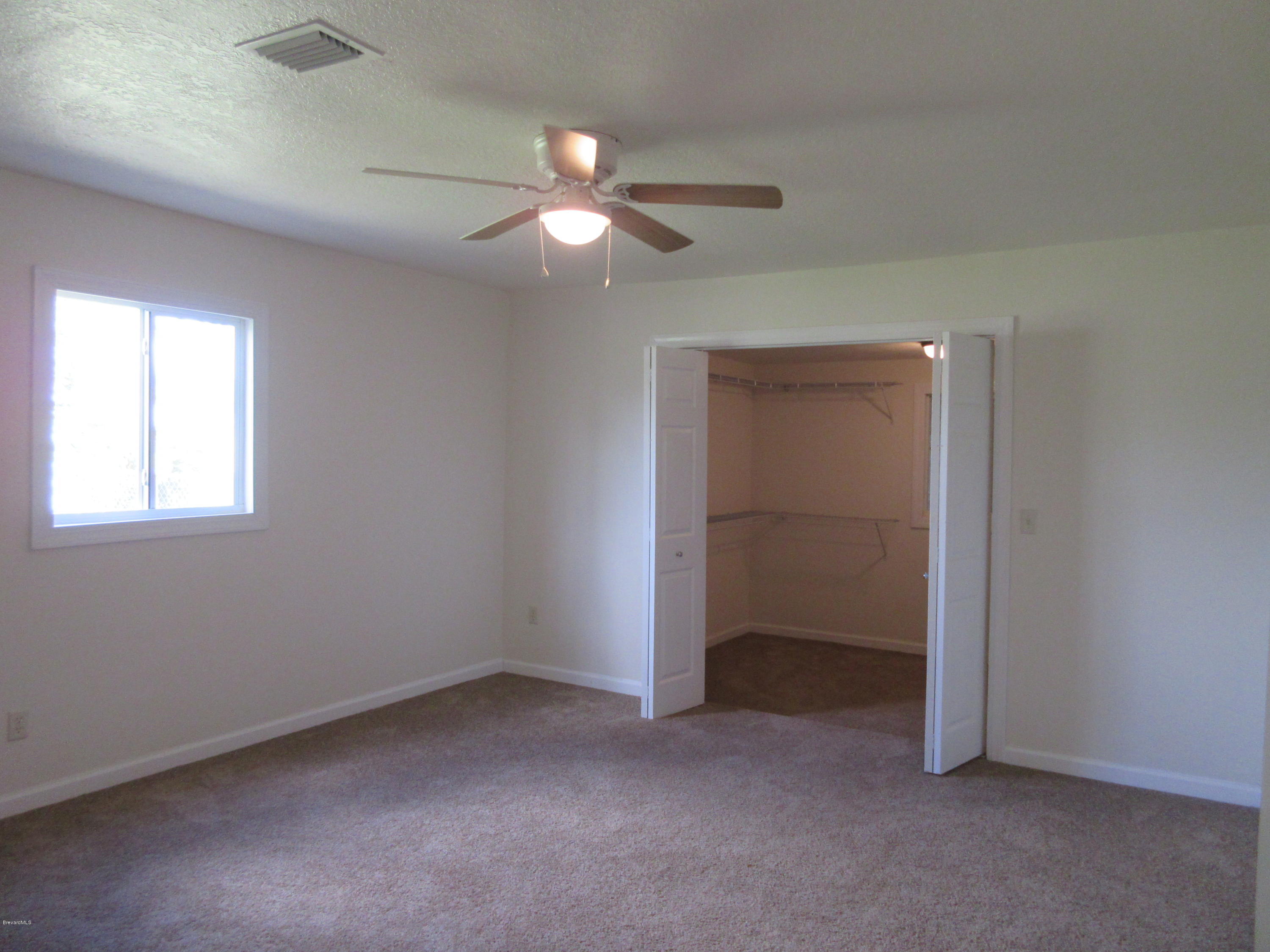 1260 Creel Road Northeast Palm Bay, FL 32905 - Photo 22 of 30 Master Bedroom