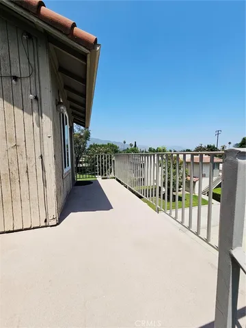a view of balcony with wooden floor