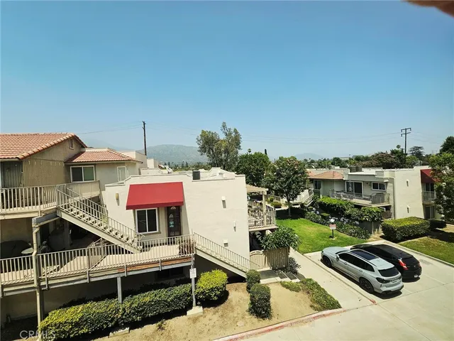 a view of a patio with table and chairs a barbeque