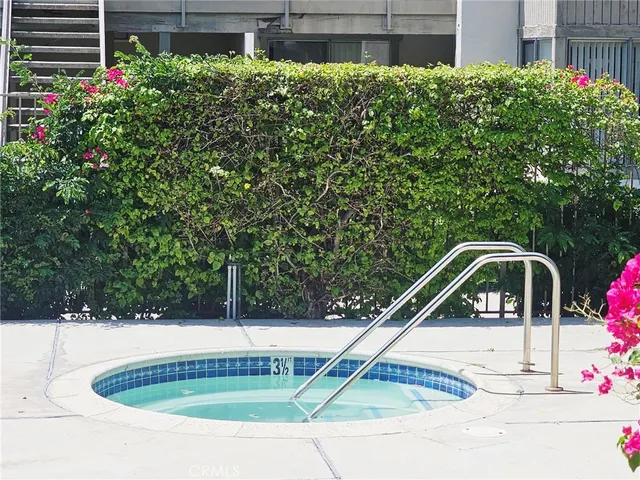 a picture of street with potted plants