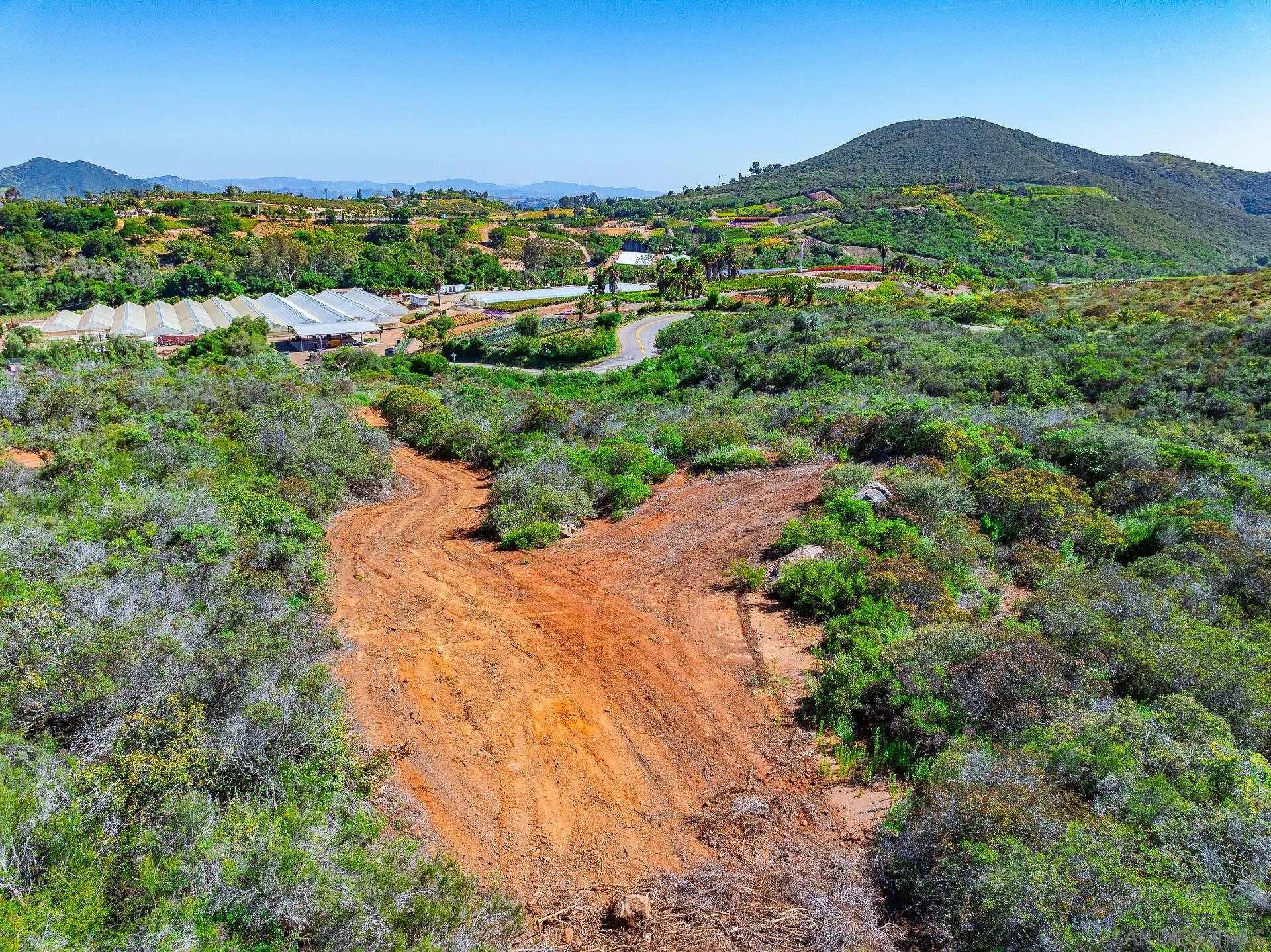 0 Rainbow Glen Fallbrook, CA 92028 - Photo 18 of 26 a view of a lush green hillside and houses