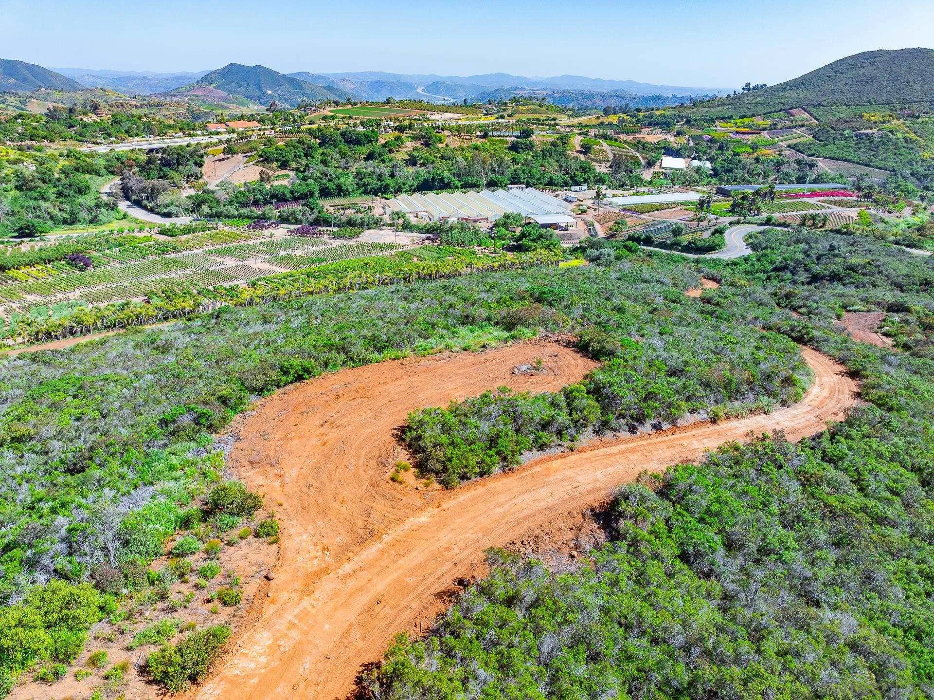 0 Rainbow Glen Fallbrook, CA 92028 - Photo 24 of 26 an aerial view of green landscape with trees houses and mountain view