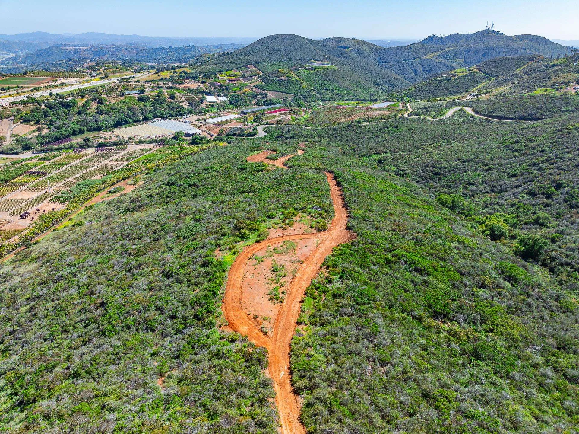 0 Rainbow Glen Fallbrook, CA 92028 - Photo 7 of 26 a view of a lush green field with mountains in the background