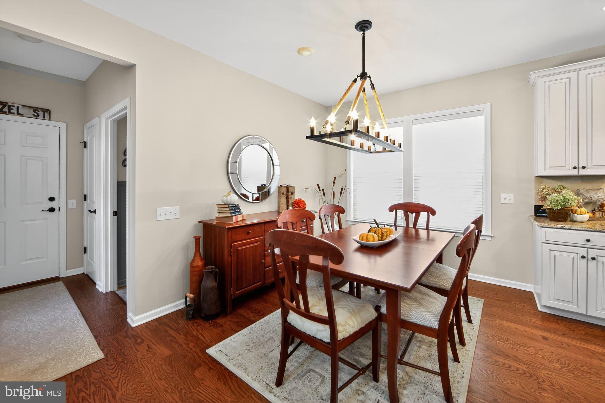 618 Kent Court Chester Springs, PA 19425 - Photo 12 of 34 a dining room with furniture a chandelier and wooden floor