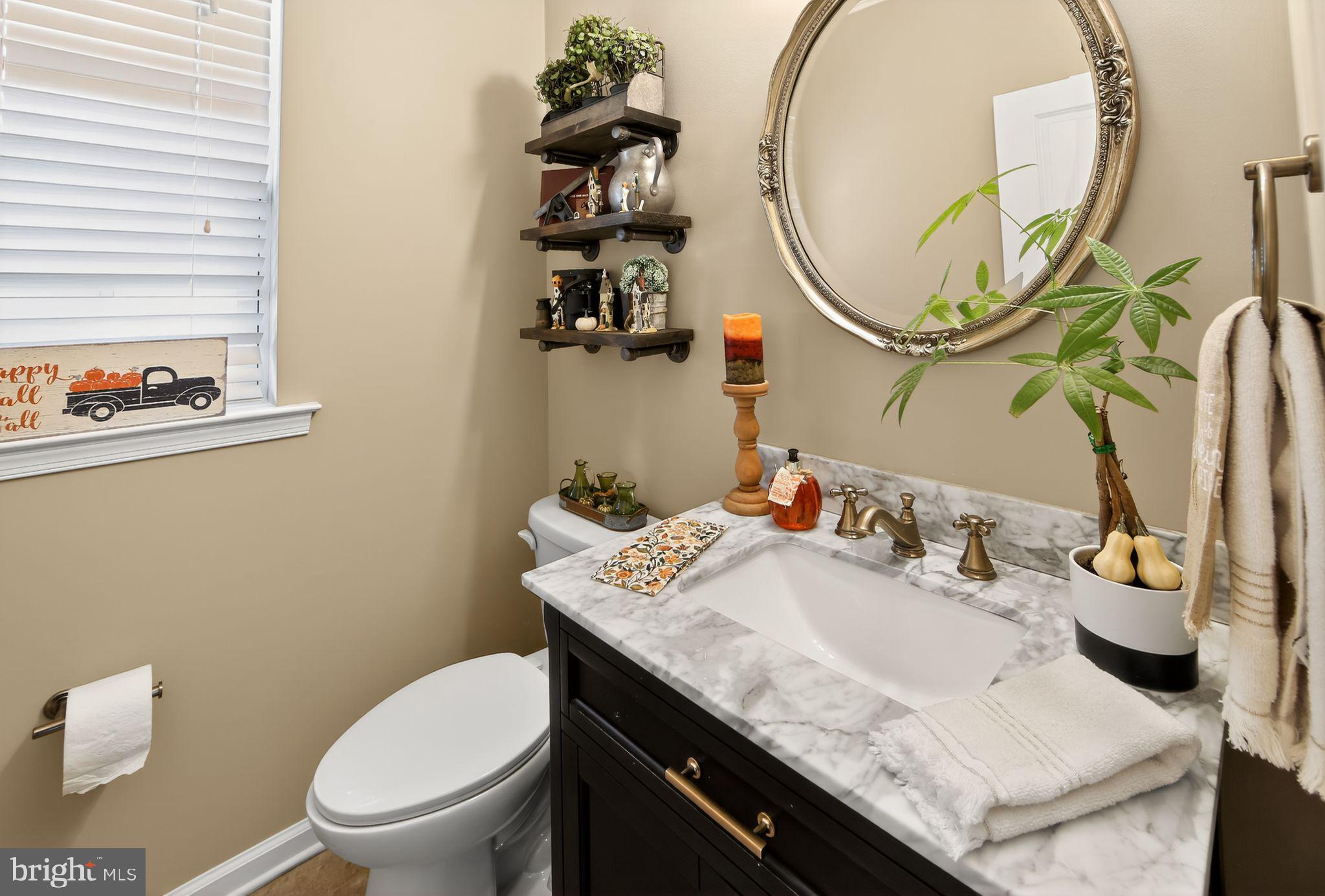 618 Kent Court Chester Springs, PA 19425 - Photo 13 of 34 a bathroom with a granite countertop sink a toilet and a mirror